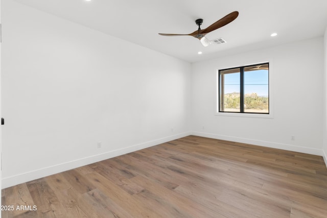 unfurnished room featuring ceiling fan and light hardwood / wood-style floors