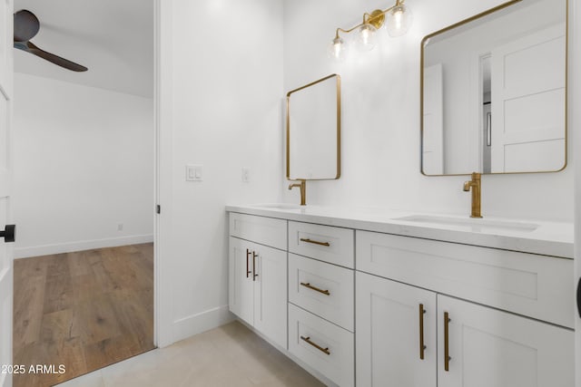 bathroom featuring hardwood / wood-style flooring, vanity, and ceiling fan