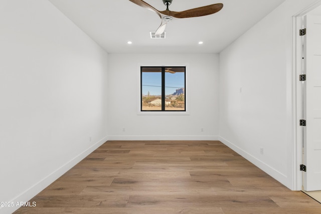 unfurnished room featuring ceiling fan and light hardwood / wood-style flooring