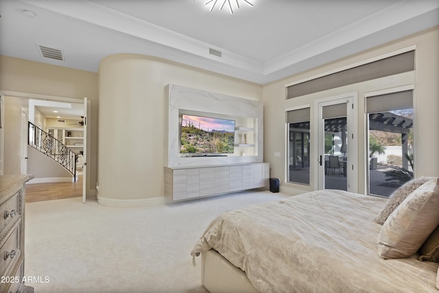 bedroom featuring access to exterior and light colored carpet