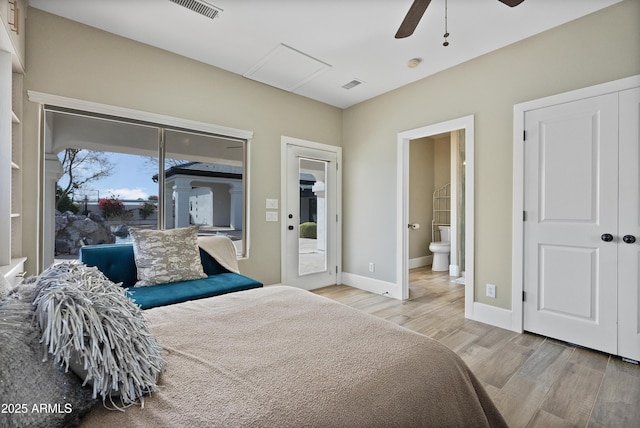 bedroom with ceiling fan, light wood-type flooring, access to outside, and ensuite bath