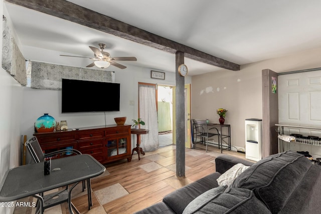 living room with a ceiling fan, light wood-type flooring, and beamed ceiling