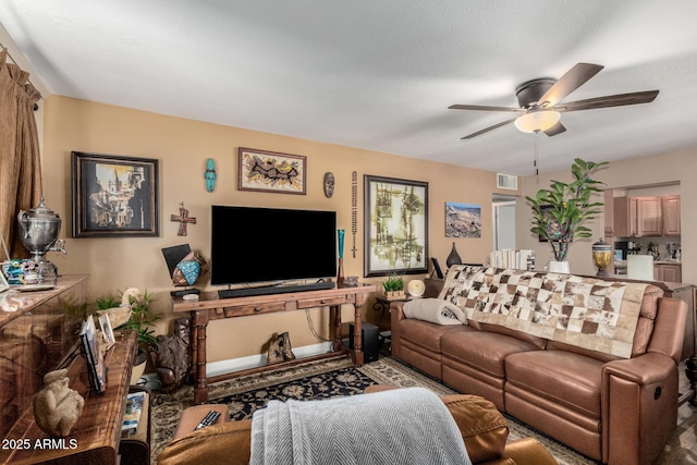 living room featuring visible vents and a ceiling fan