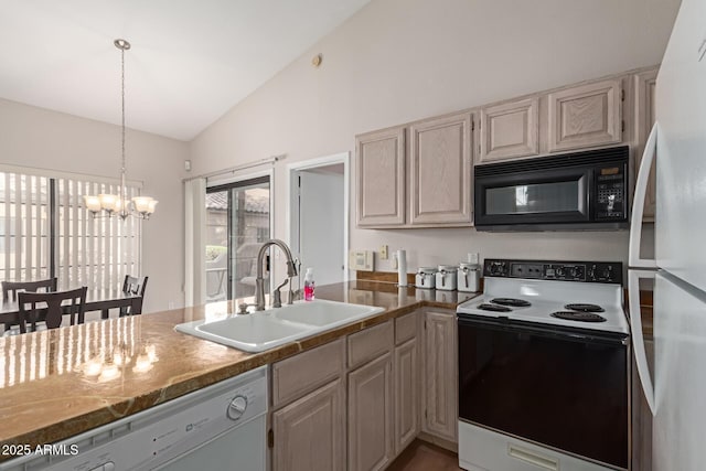 kitchen with white appliances, hanging light fixtures, vaulted ceiling, a chandelier, and a sink