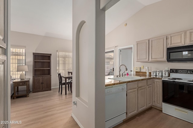 kitchen featuring black microwave, electric range oven, a sink, dishwasher, and light wood finished floors