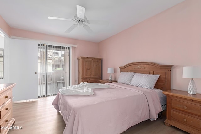 bedroom with access to exterior, light wood finished floors, and a ceiling fan