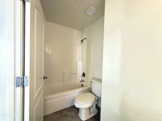 bathroom with toilet, visible vents, and shower / bathing tub combination