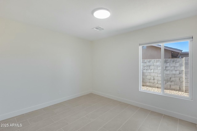 spare room featuring a wealth of natural light