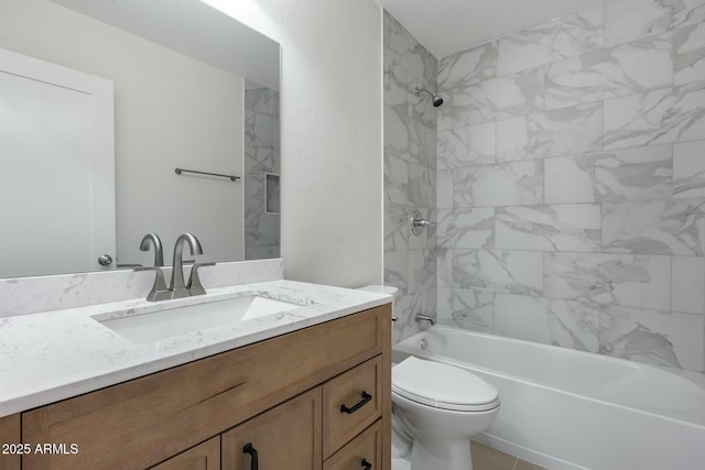 full bathroom with vanity, toilet, and tiled shower / bath