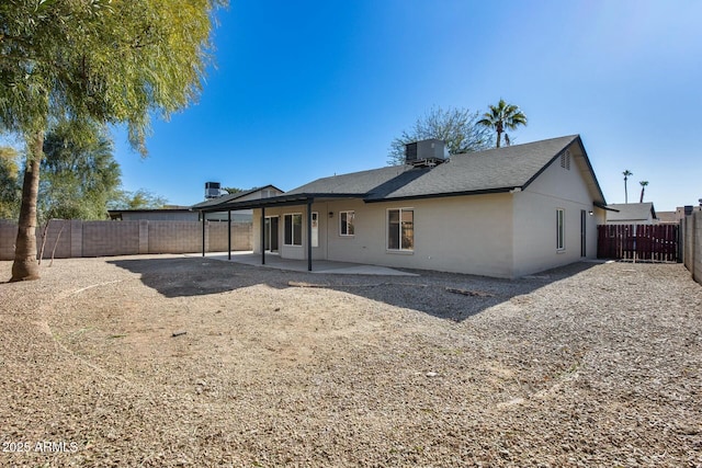 back of house with a patio and central AC