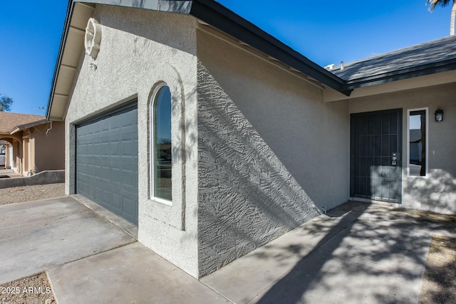 view of property exterior with a garage