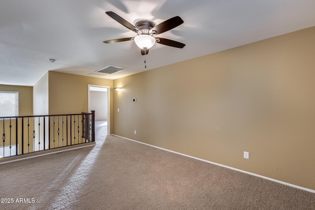 carpeted empty room with ceiling fan