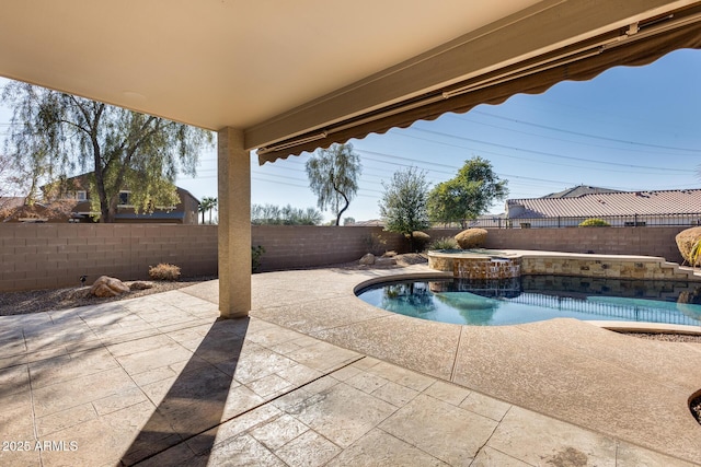 view of swimming pool featuring an in ground hot tub and a patio area