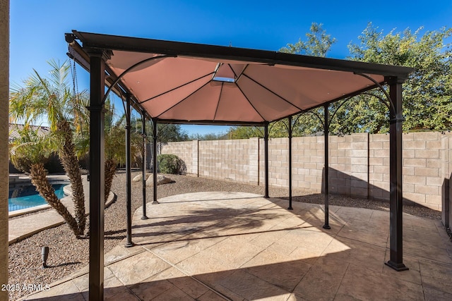 view of patio / terrace with a gazebo and a fenced in pool