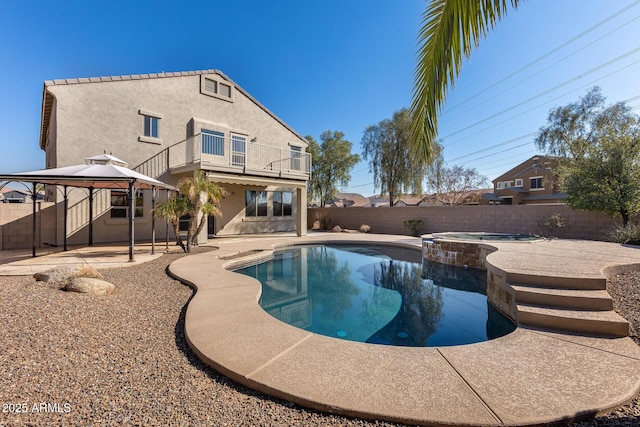 view of pool with a gazebo, an in ground hot tub, and a patio