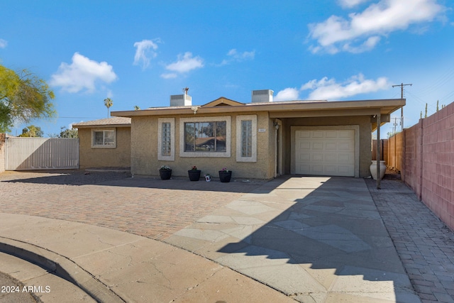 ranch-style house featuring a garage