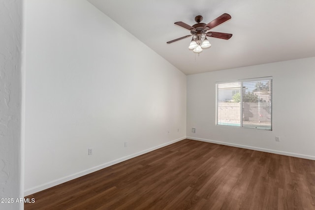 unfurnished room with ceiling fan, dark hardwood / wood-style flooring, and vaulted ceiling