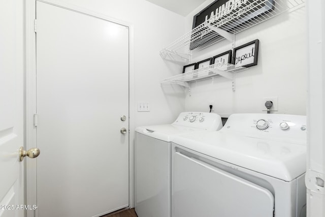 clothes washing area with separate washer and dryer