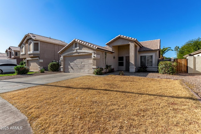 view of front of home featuring a garage and a front lawn