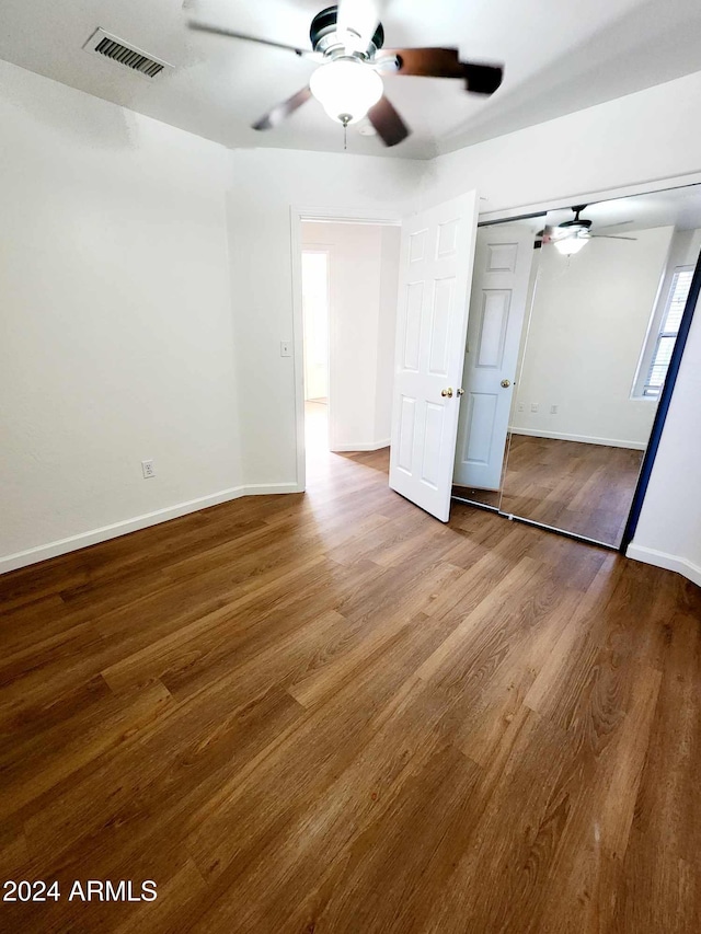 unfurnished room featuring wood-type flooring