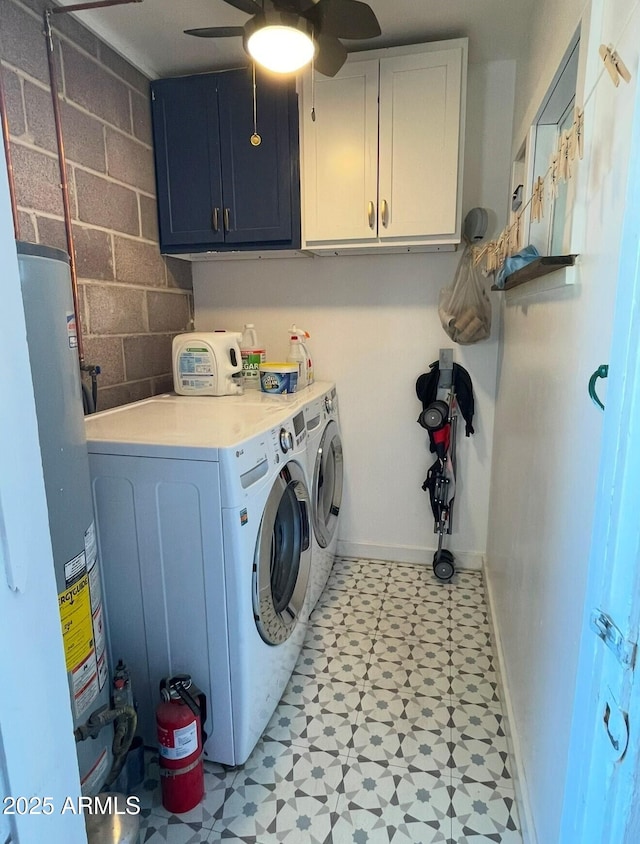 washroom featuring cabinets, water heater, washer and clothes dryer, and ceiling fan