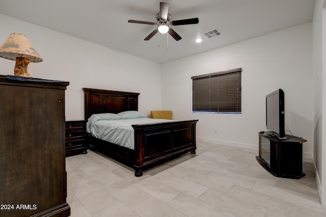 tiled bedroom featuring ceiling fan