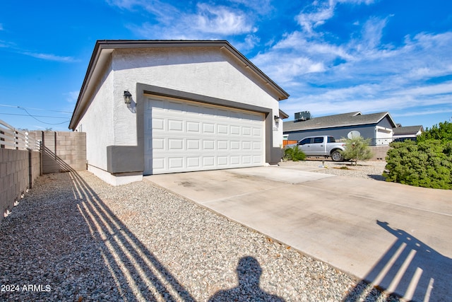 view of property exterior featuring a garage