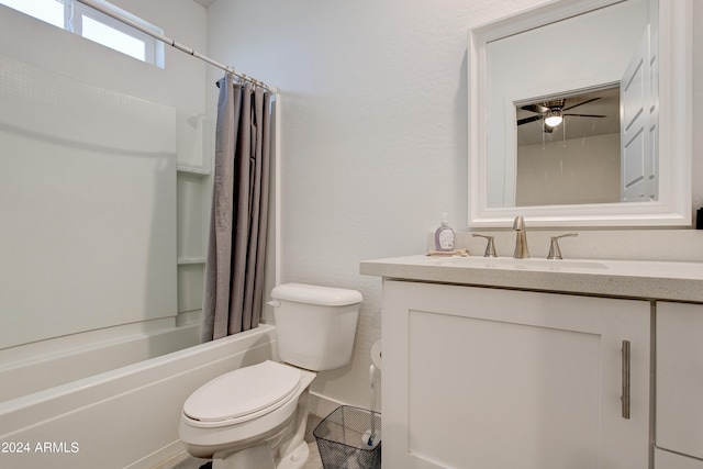 full bathroom with ceiling fan, vanity, shower / tub combo, and toilet