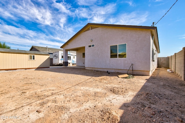 back of property featuring a patio area