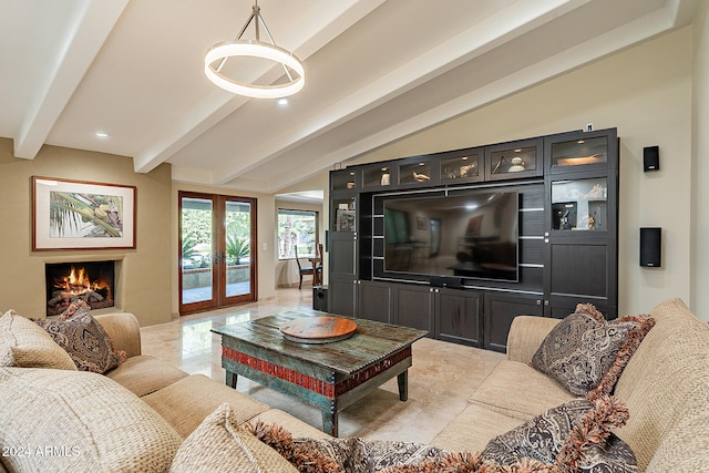 living room featuring french doors and beamed ceiling