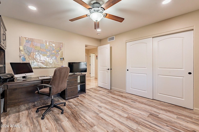 office space featuring light hardwood / wood-style flooring and ceiling fan