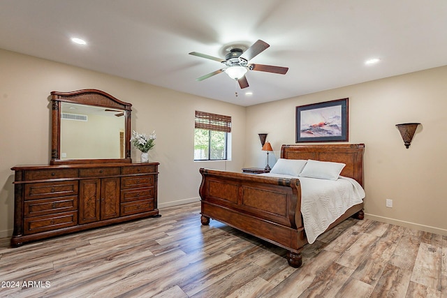 bedroom featuring light hardwood / wood-style floors and ceiling fan