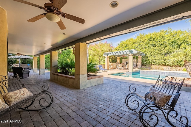 view of patio featuring ceiling fan