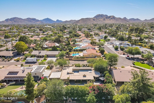 birds eye view of property with a mountain view