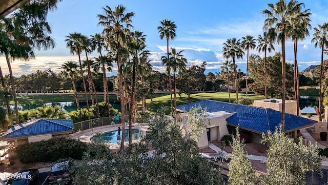 view of swimming pool with a water view