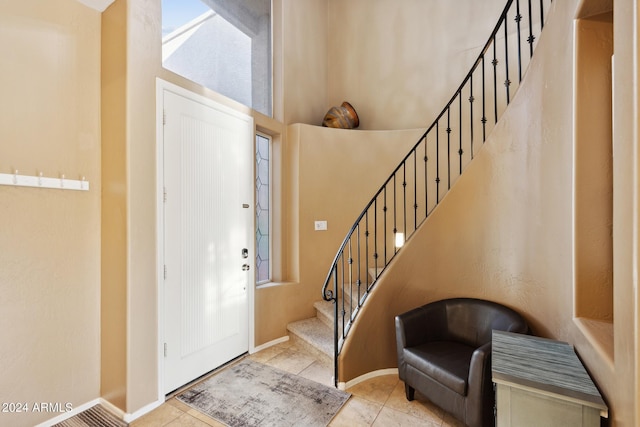 foyer entrance featuring light tile patterned floors