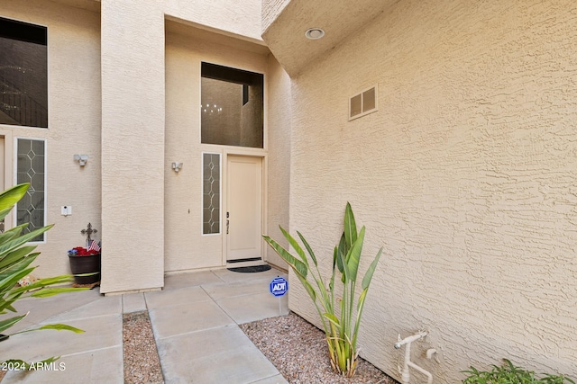 doorway to property with a patio area