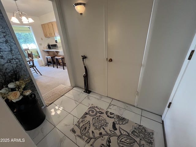 foyer featuring a notable chandelier