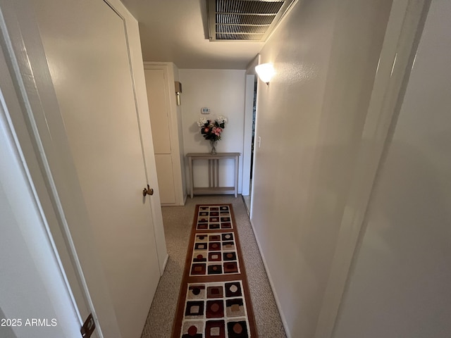 hallway with carpet flooring