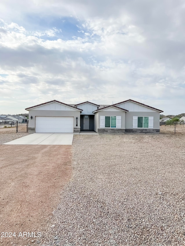 ranch-style house featuring a garage