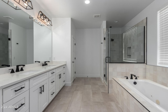 bathroom featuring tile patterned flooring, vanity, and independent shower and bath