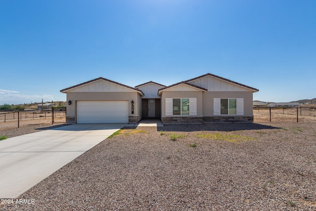 ranch-style home with a garage