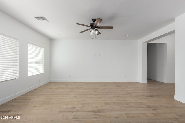 spare room with light hardwood / wood-style floors and ceiling fan