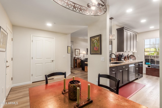 dining area featuring light hardwood / wood-style flooring and sink