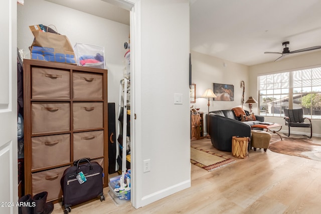 interior space featuring ceiling fan and light wood-type flooring