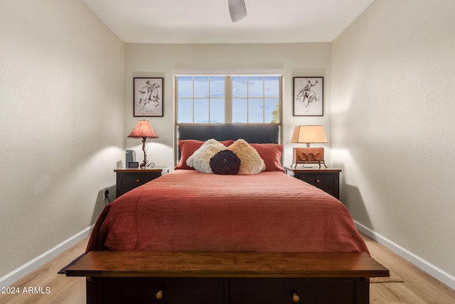 bedroom with ceiling fan and light hardwood / wood-style flooring