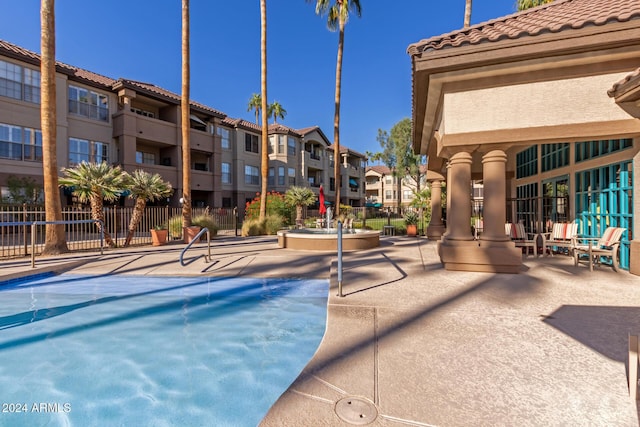 14950 W Mountain View Blvd Unit 4205, Surprise, AZ 85374 - view of pool featuring fence, a patio area, and a residential view