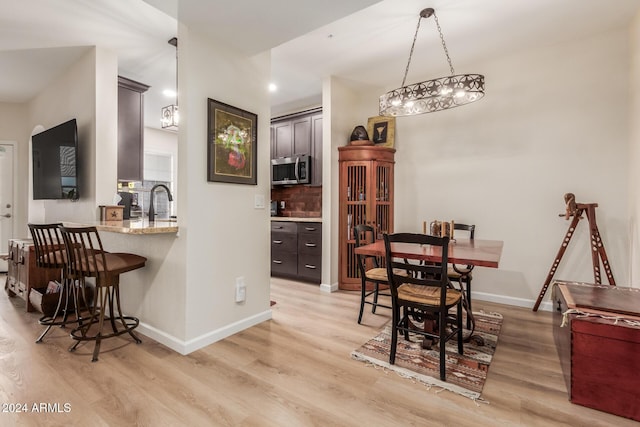 14950 W Mountain View Blvd Unit 4205, Surprise, AZ 85374 - dining area with light wood-style floors and baseboards