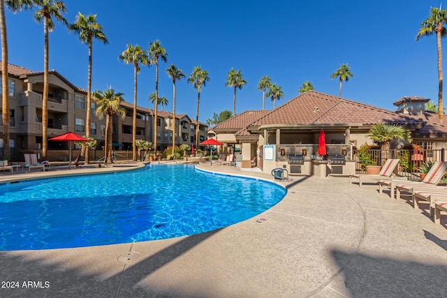 14950 W Mountain View Blvd Unit 4205, Surprise, AZ 85374 - community pool with fence, a patio area, and area for grilling