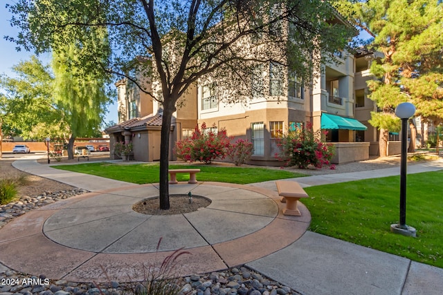 view of community featuring a yard